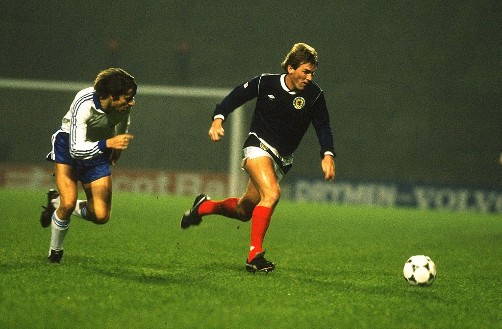 Kenny Dalglish of Scotland in action during a match against the German Democratic Republic in Scotland. The match ended in a 0-0 draw