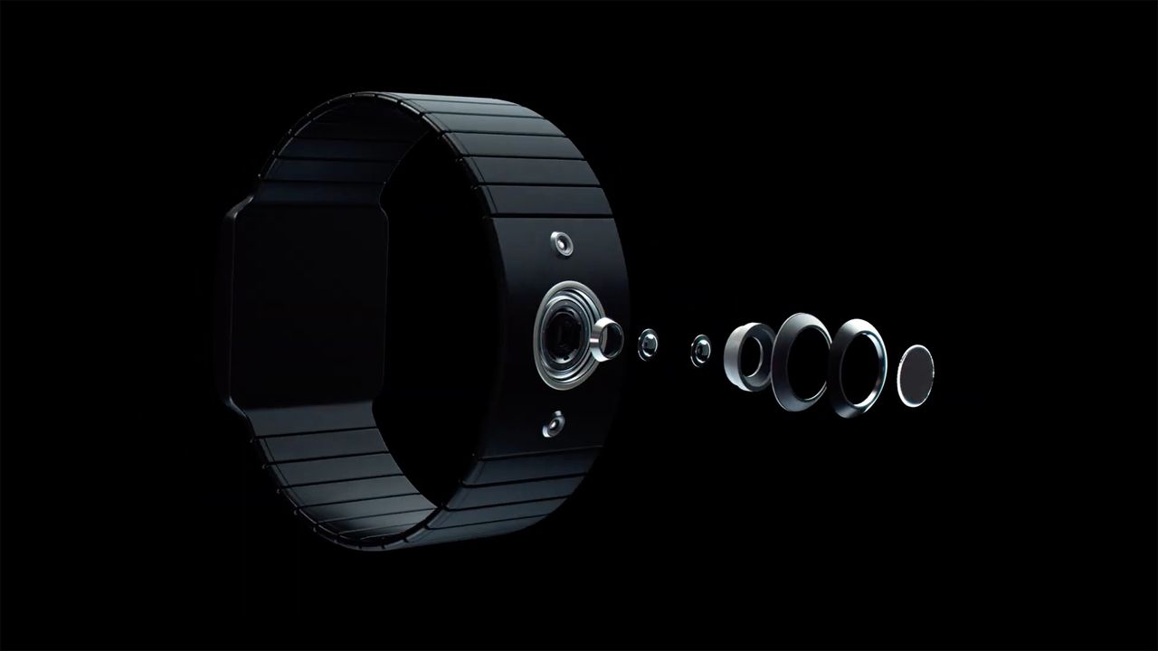 The HndsUp civilian camera with an exploded view of its camera lens components against a dark background