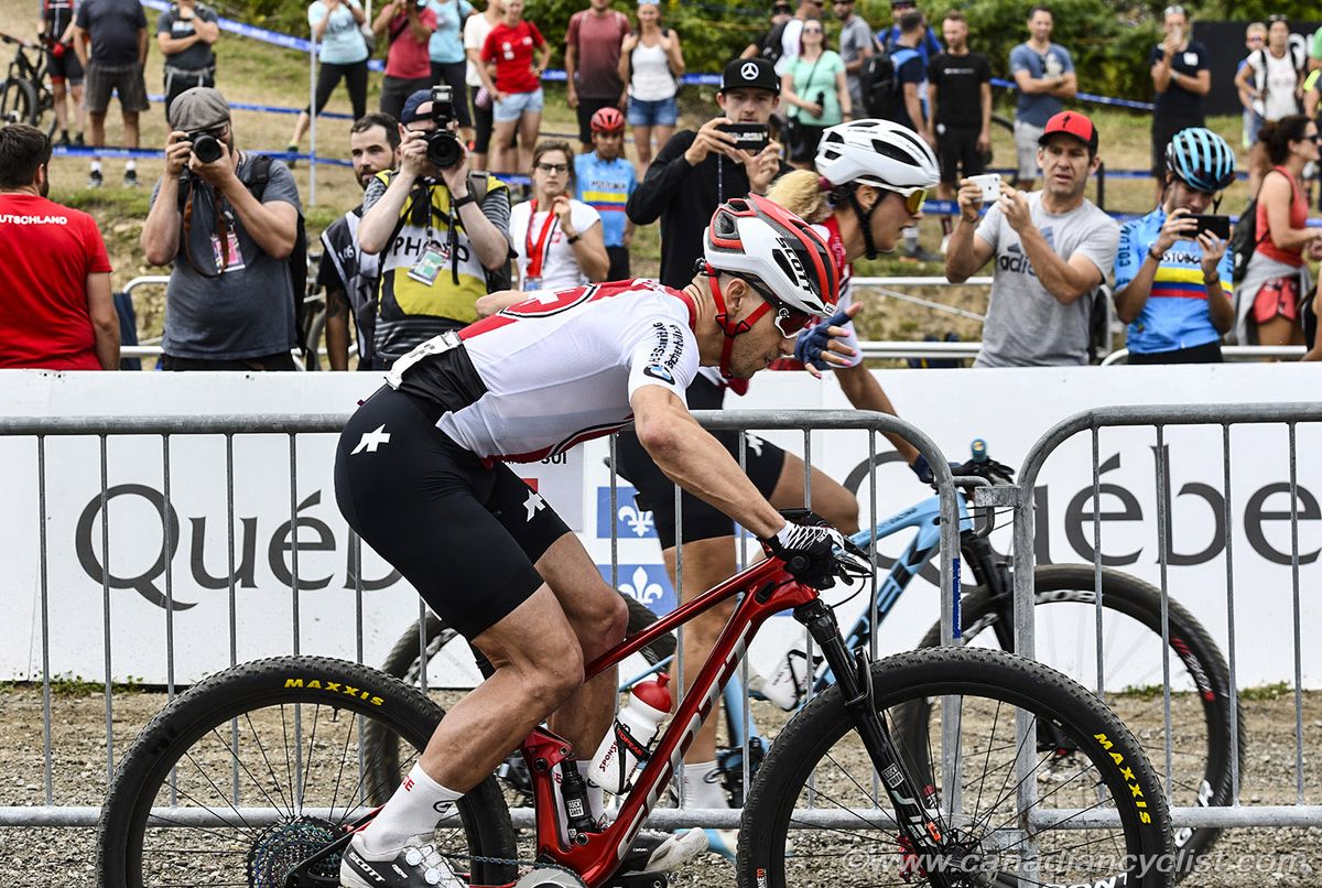 Switzerland's Jolanda Neff hands off to Nino Schurter