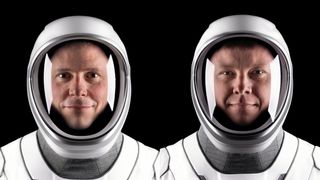 two astronauts in spacesuits with visors up, side by side