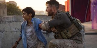 Chris Hemsworth and Rudhraksh Jaiswal in Extraction