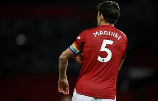 Manchester United’s Harry Maguire wears a rainbow coloured captain’s armband in support of the Rainbow Laces campaign during the Premier League match at Old Trafford, Manchester