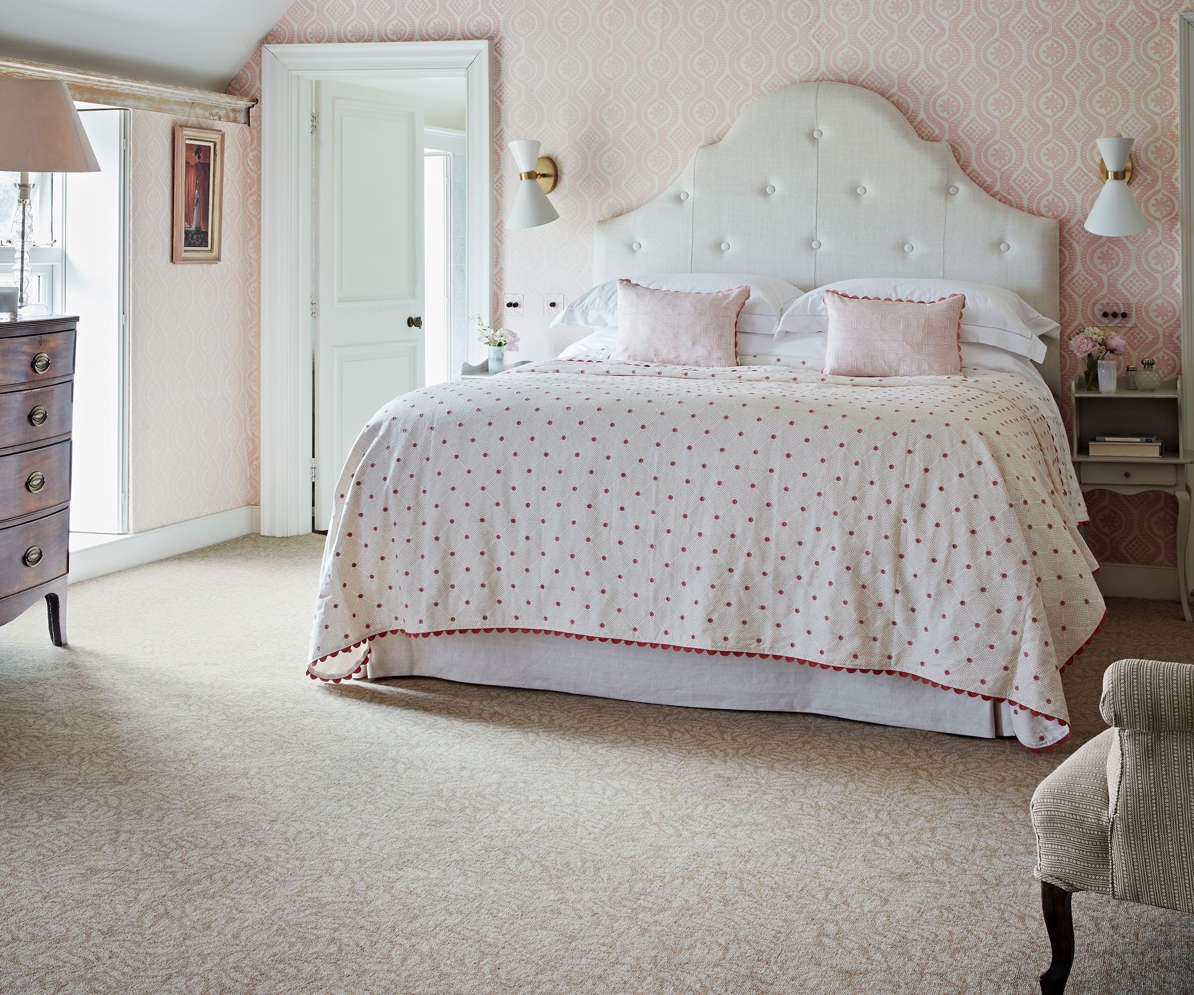 pale master bedroom scheme with light patterned carpet