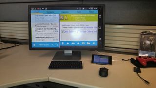 An Android phone mirroring its display on a computer monitor via HDMI. Credit: MHLTech.org