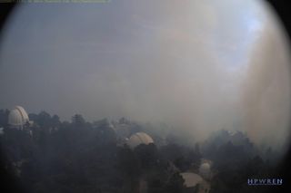 A view of the smoke caused by the Bobcat Fire, as seen from an east-facing HPWREN live webcam atop the Mount Wilson Observatory. This picture was taken at 11:13 a.m. PDT (1813 GMT) on Sept. 17, 2020.