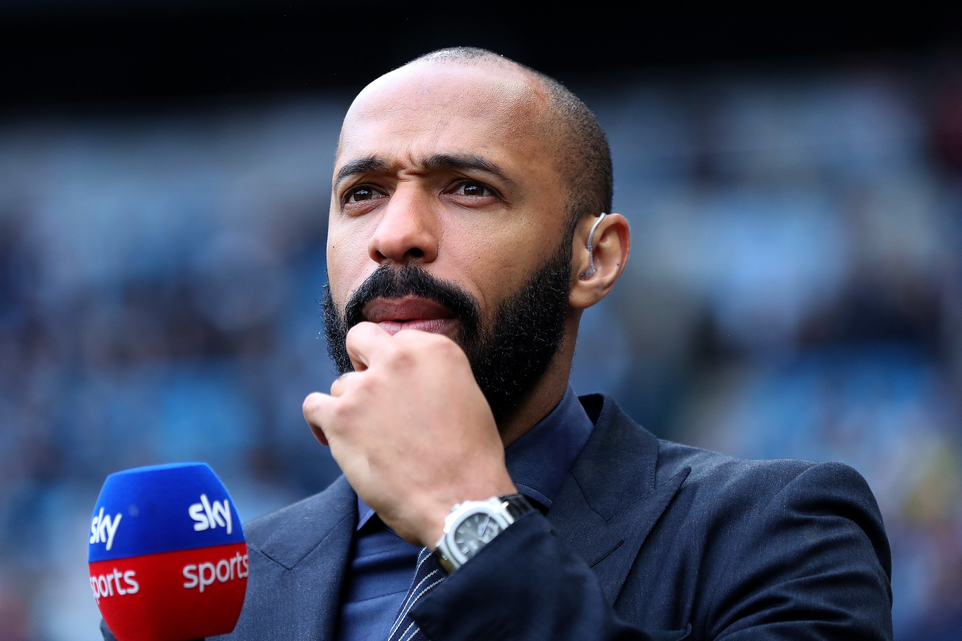 Thierry Henry holding a Sky Sports microphone