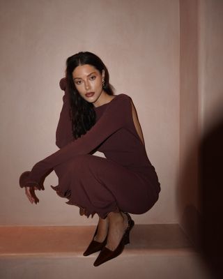 Woman wearing brown maxi dress.