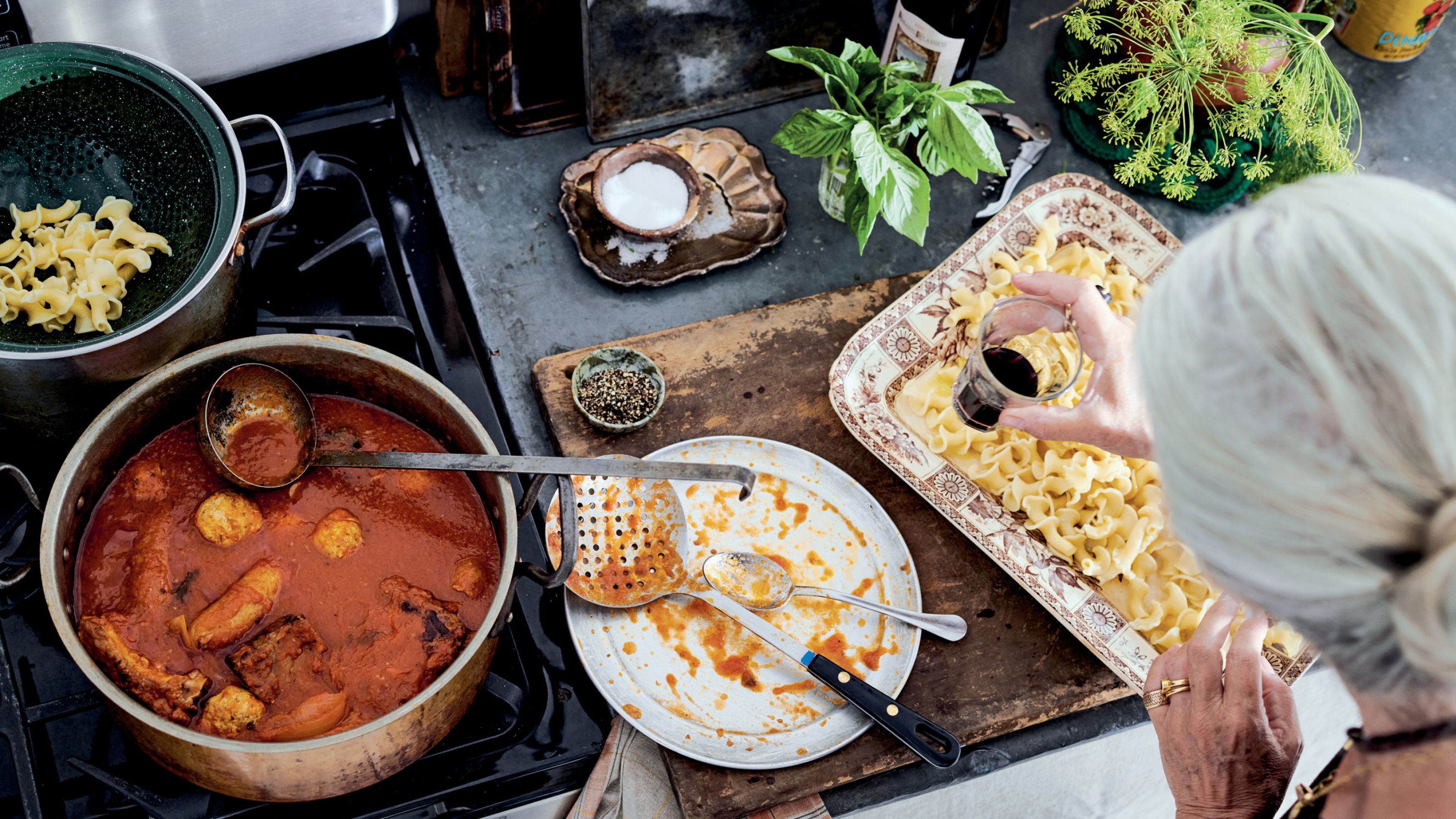 Lucinda Scala Quinn cooking a recipe from her book, Mother Sauce