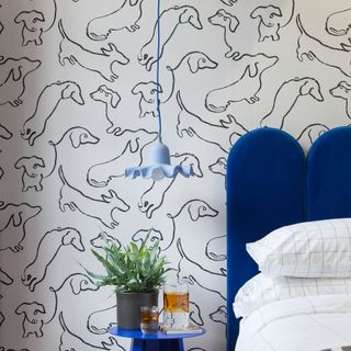 bedroom with white black designed wallpaper and plant pot