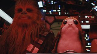 Chewbacca is joined by a porg in the cockpit of the Millennium Falcon. Neal Scanlan’s animatronic porgs were used hand-in-hand with ILM’s digital creations