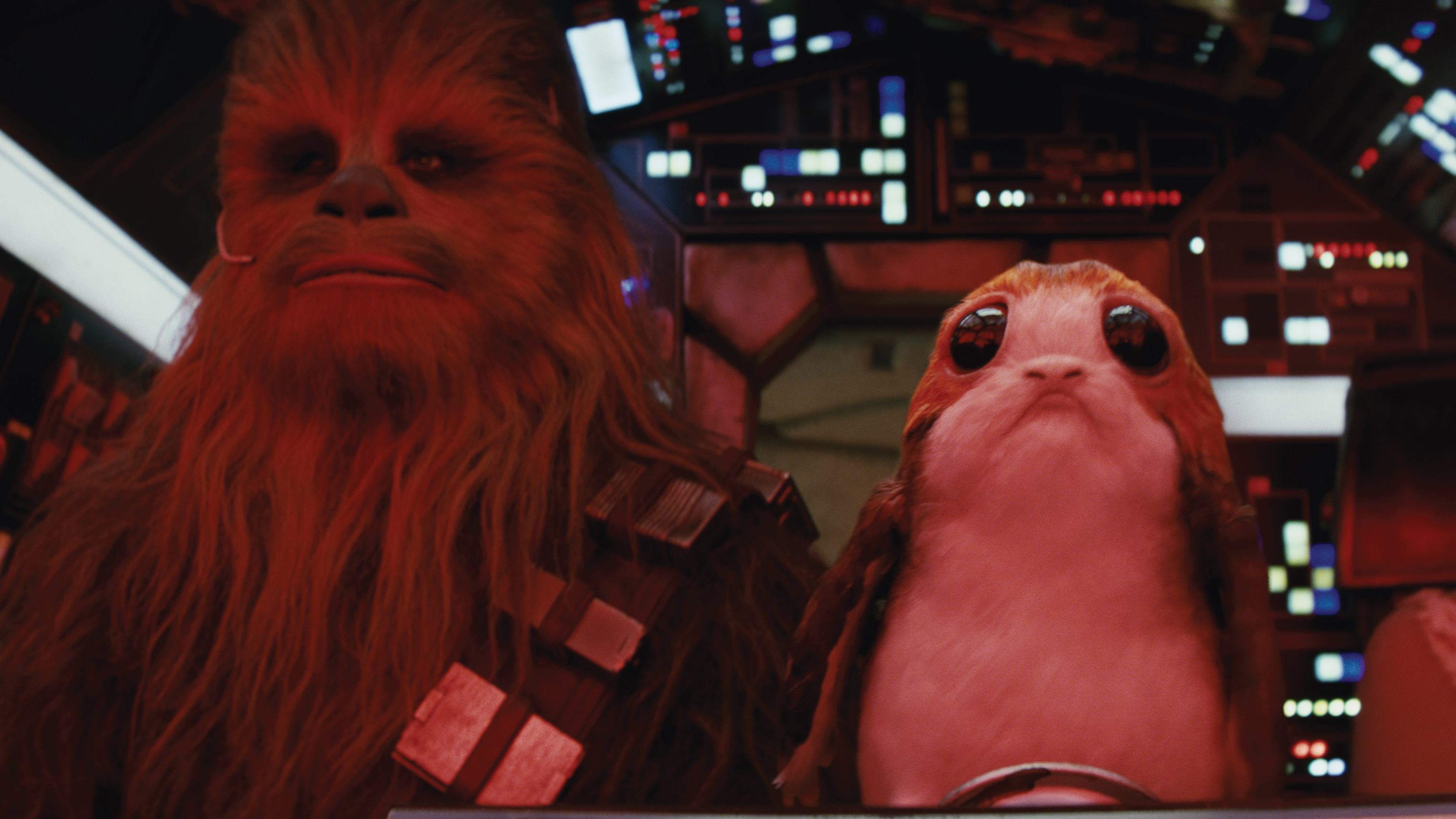 Chewbacca is joined by a porg in the cockpit of the Millennium Falcon. Neal Scanlan’s animatronic porgs were used hand-in-hand with ILM’s digital creations