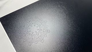 Cricut Joy Xtra review; a piece of black vinyl with a details snowflake design