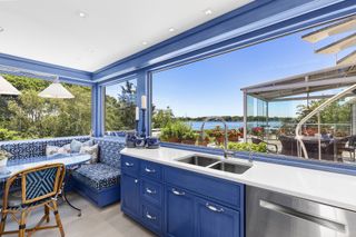 blue kitchen and banquette seating in Long Island