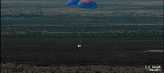 Blue Origin's New Shepard space capsule floats back to Earth under parachutes after a successful unmanned suborbital test flight from the company's West Texas facility on Nov. 23, 2015.