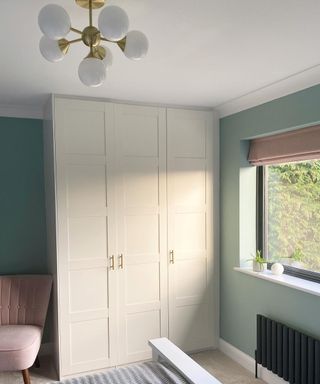 A wardrobe with white ceiling and gold light fitting