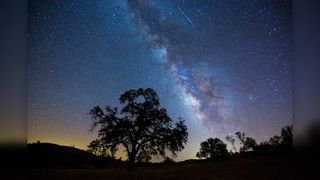 The Milky Way and several "shooting stars" or meteors from the Perseid meteor shower in 2015.