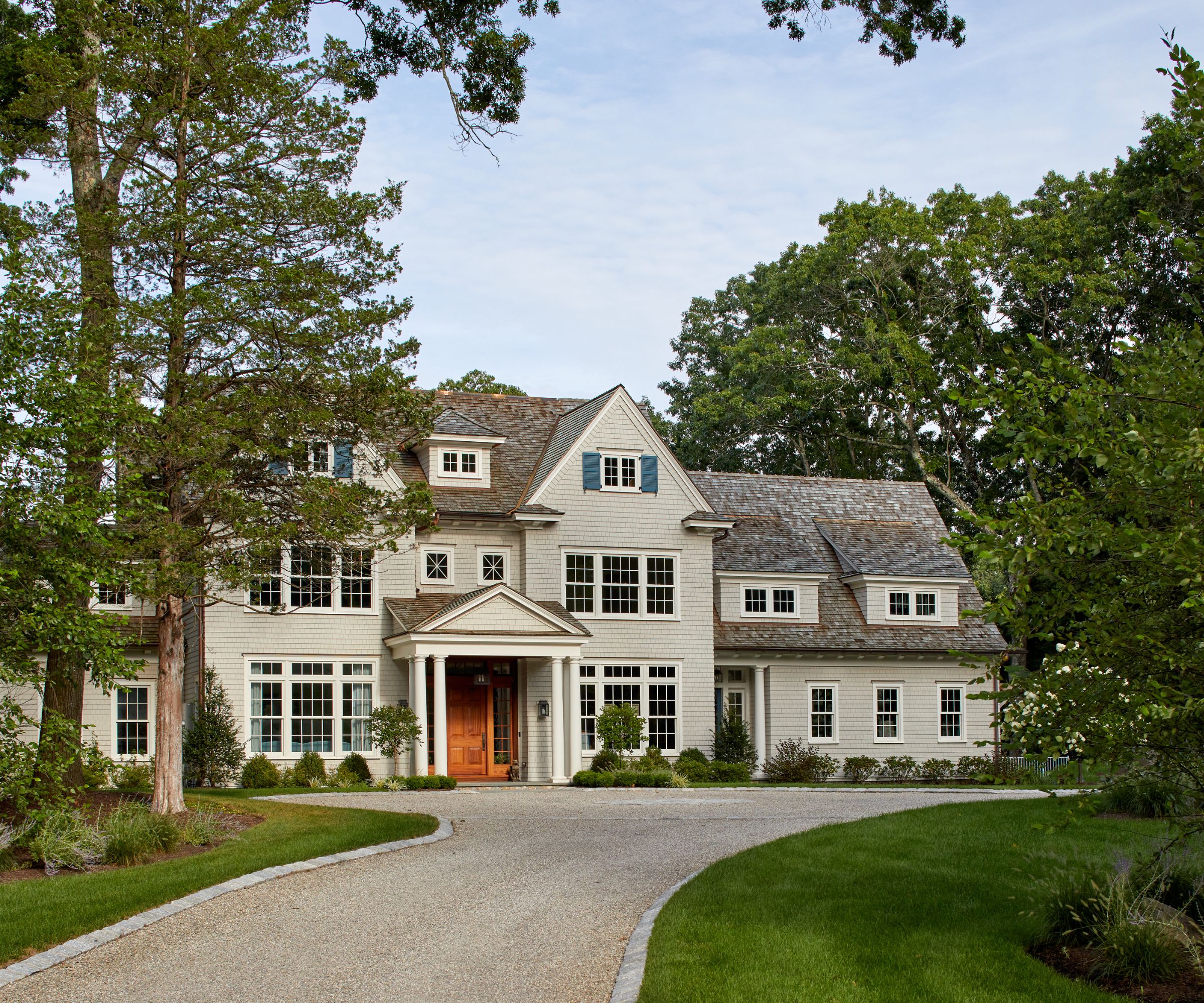 Soft green home in a leafy landscape
