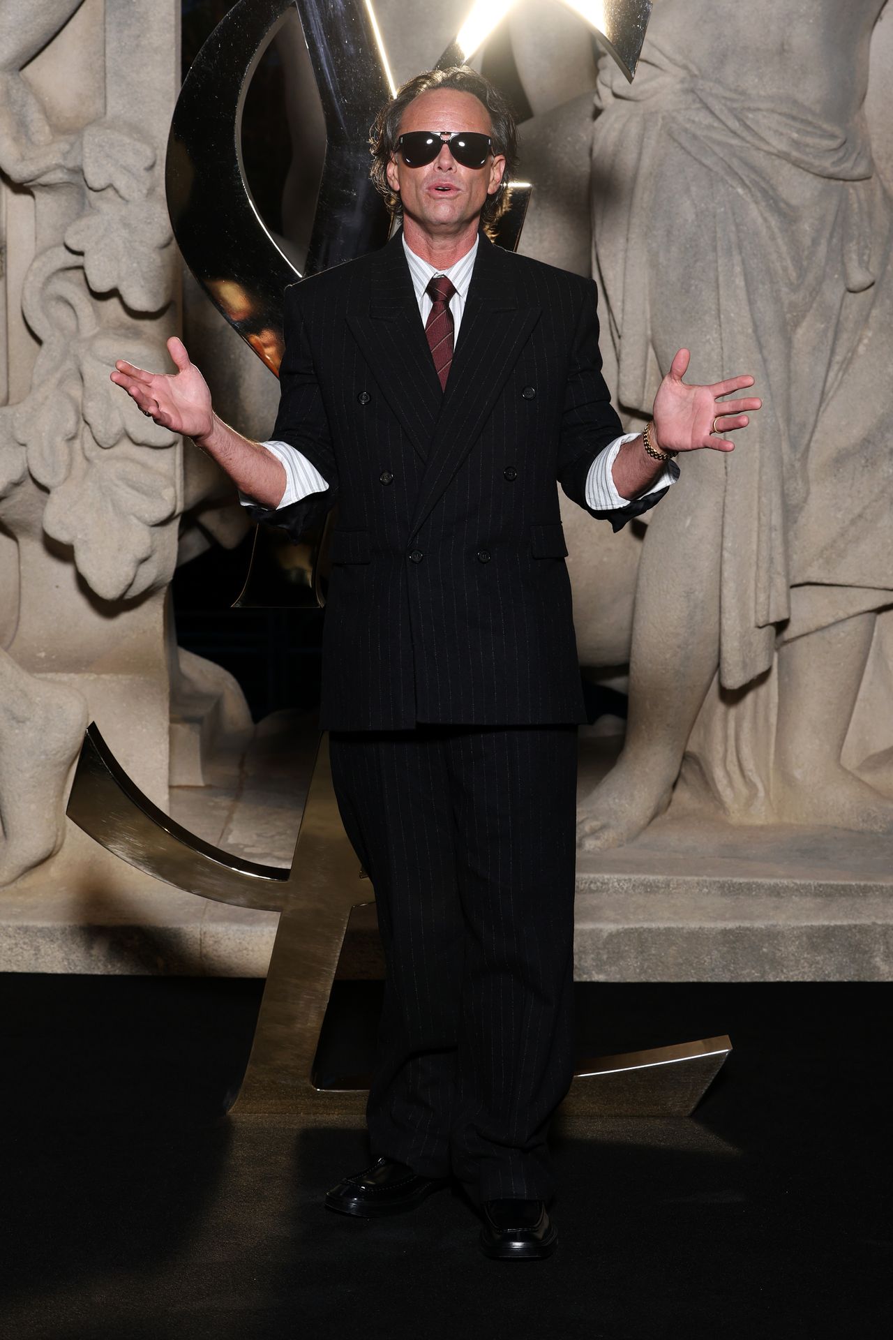 walter goggins wearing a black suit at the saint laurent show