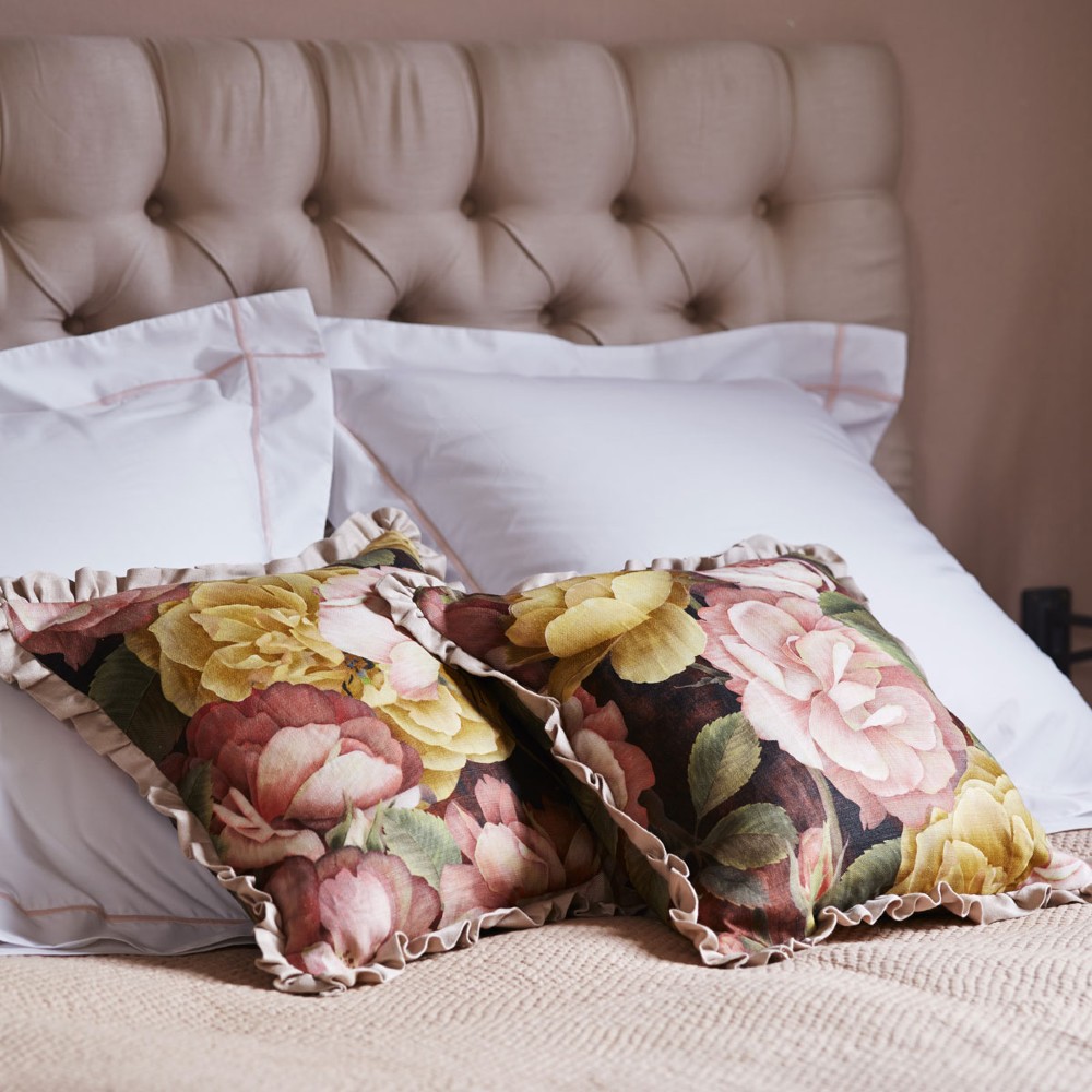 bed with pillow and cushions