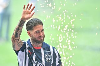 Sergio Ramos waves to fans during his Monterrey presentation in February 2025.