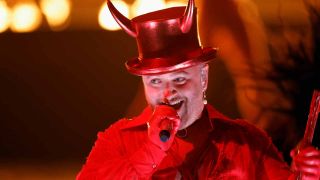 Sam Smith in devil horns onstage at the Grammys