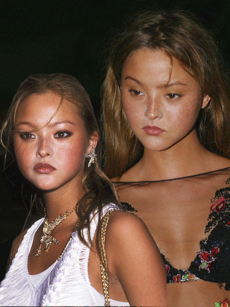 Devon Aoki with a bronzed complexion, thin brows, and flushed cheeks