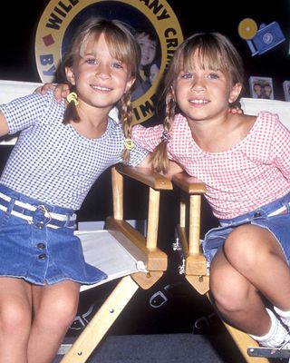 The Olsen sisters wear braided pigtails as young girls in 1994.