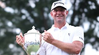 Lucas Glover with the trophy after winning the Wyndham Championship at Sedgefield Country Club