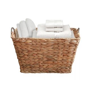 woven linen basket with white towels