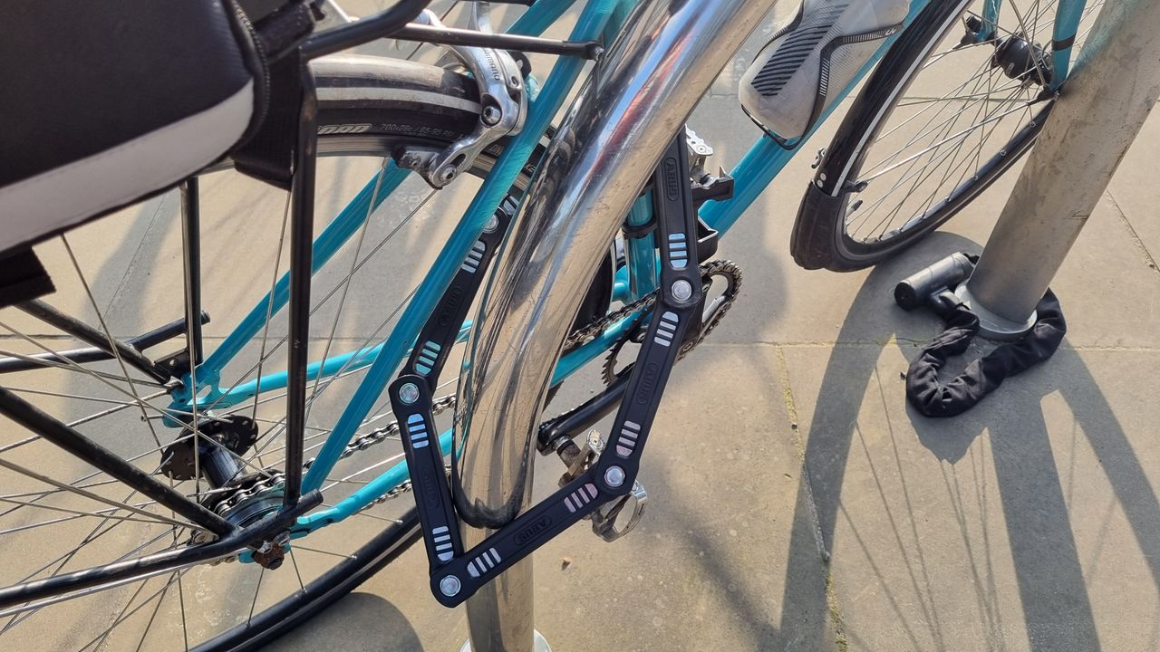 The Abus Bordo 6200K lock securing a bike to a stand, with lots of room between