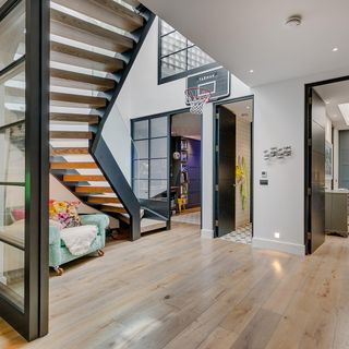 atrium with white wall steps wooden flooring