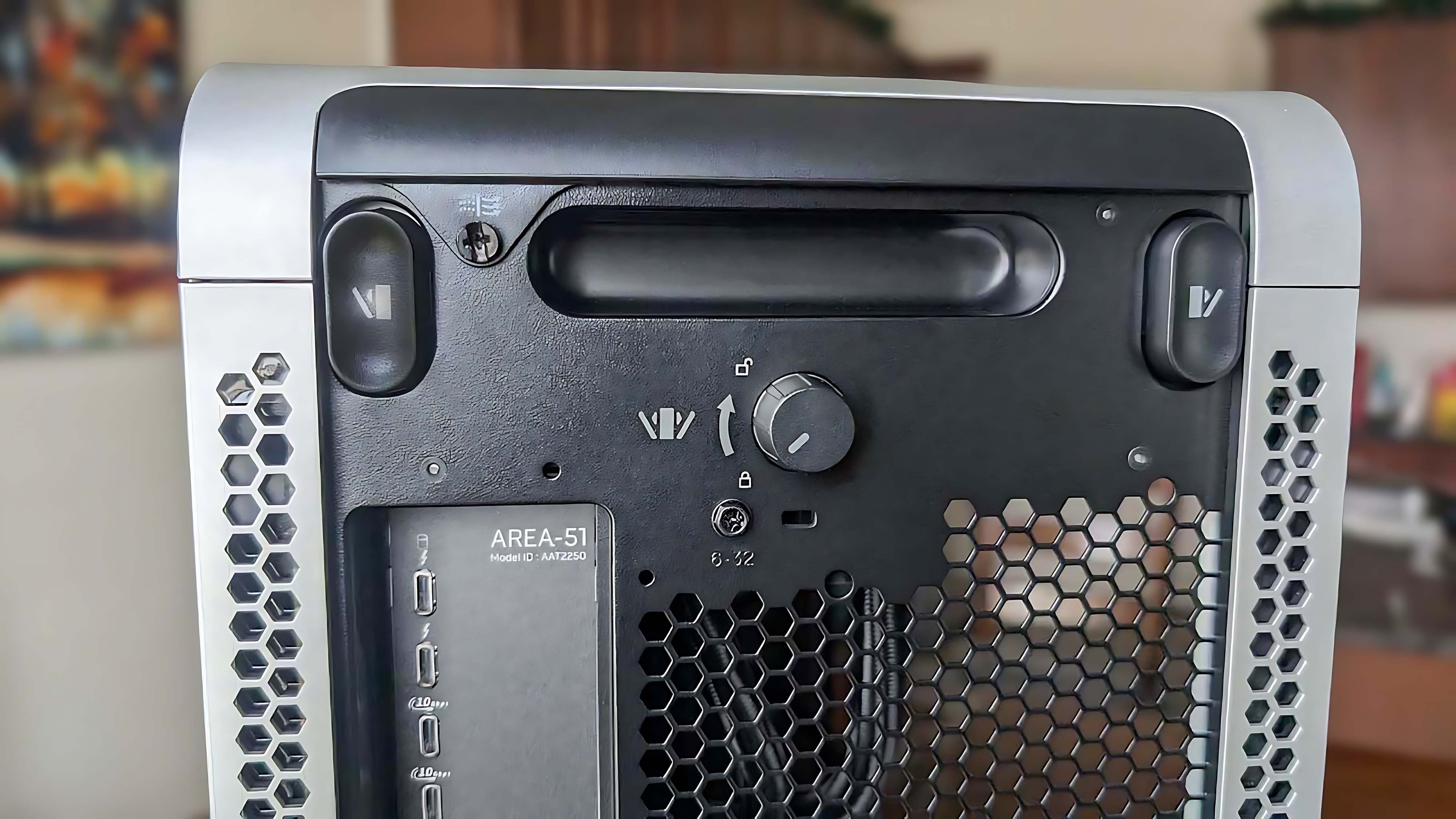 Closeup of the windows unlock buttons on the back of the release Alienware Area-51 Gaming Desktop (2025).