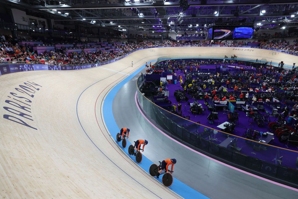 Netherlands' Kyra Lamberink, Netherlands' Hetty van de Wouw and Netherlands' Steffie van der Peet compete in the women's track cycling team sprint first round of the Paris 2024 Olympic Games at the Saint-Quentin-en-Yvelines National Velodrome in Montigny-le-Bretonneux, south-west of Paris, on August 5, 2024. (Photo by Emmanuel DUNAND / AFP)