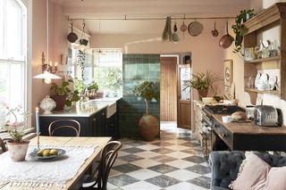 pink and green open plan kitchen in renovated house