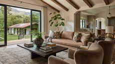 a large open plan Santa Barbara home with vaulted ceiling, patio doors out to a pool area and casita
