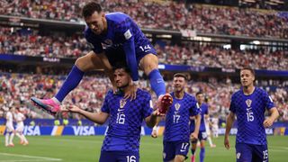 Martin Baturina of Croatia celebrates after scoring a goal to make it 1-1 with Ivan Perisic of Croatia during the FIFA World Cup 2026 Group L match between England and Croatia