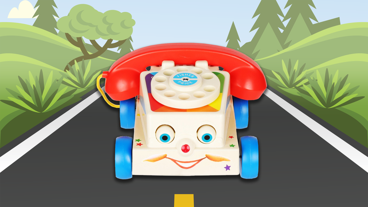 Fisher Price &#039;Chatter&#039; toy phone on a vector road background