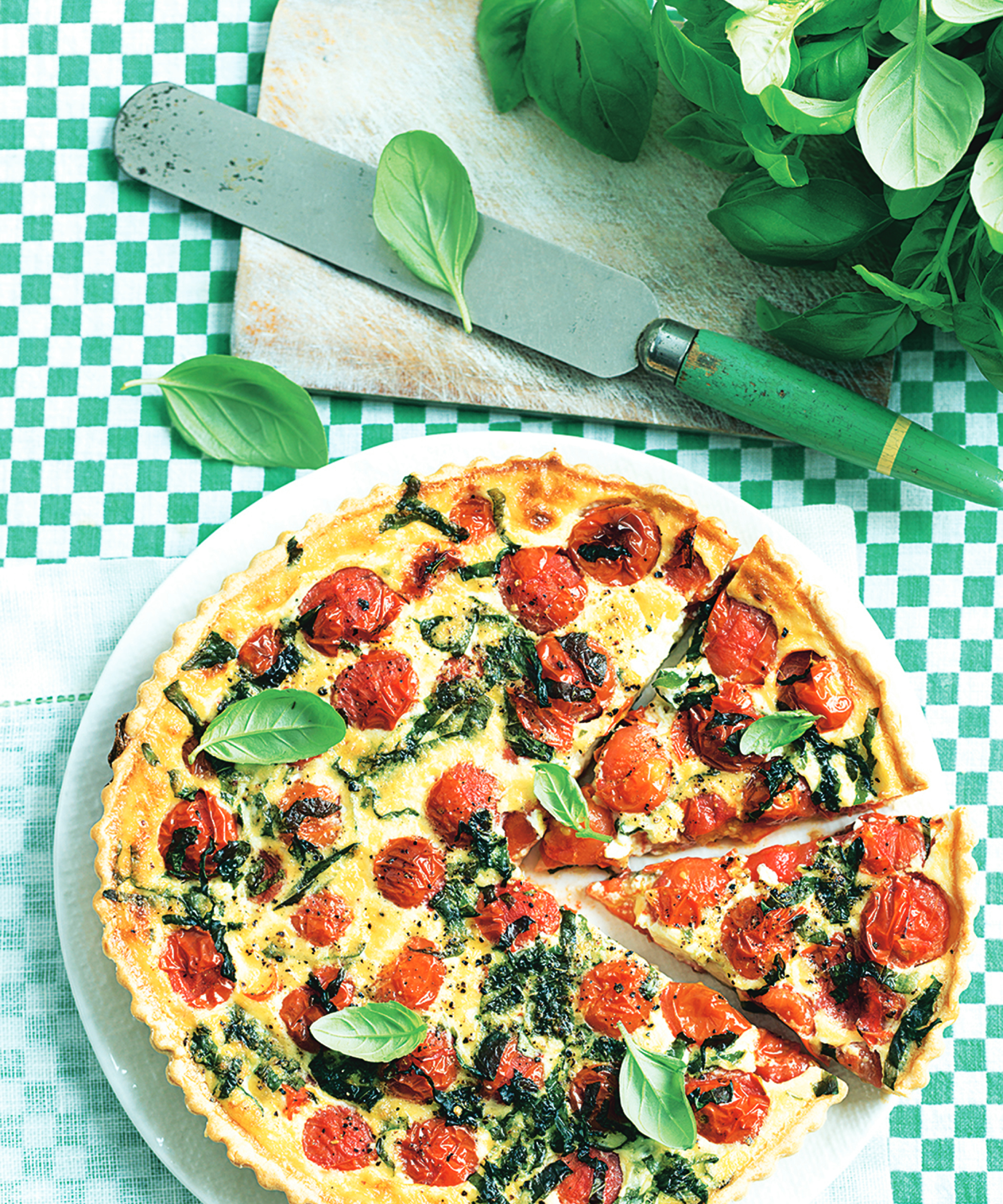tomato and basic quiche make using homegrown tomatoes and basil, cut ready for a picnic