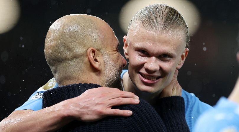 Manchester City manager Pep Guardiola speaks to Erling Haaland after the team&#039;s 3-0 win away to Manchester United in October 2023.