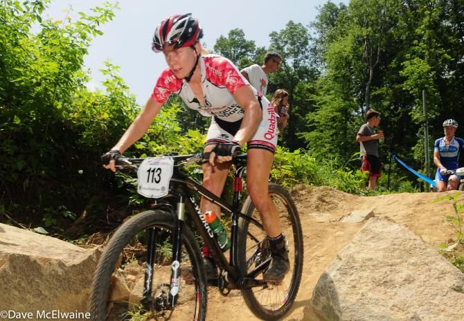 Jamie Busch (Quadzilla Racing) near the end of lap one with Georgia Gould walking behind her.