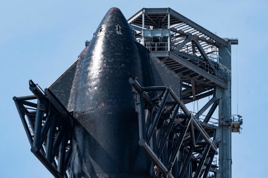 SpaceX's first orbital Starship SN20 is stacked atop its massive Super Heavy Booster 4 at the company's Starbase facility near Boca Chica Village in South Texas on Feb. 10, 2022.