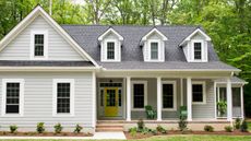 large home exterior with shiplap and landscaping