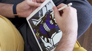 Someone drawing on an iPad