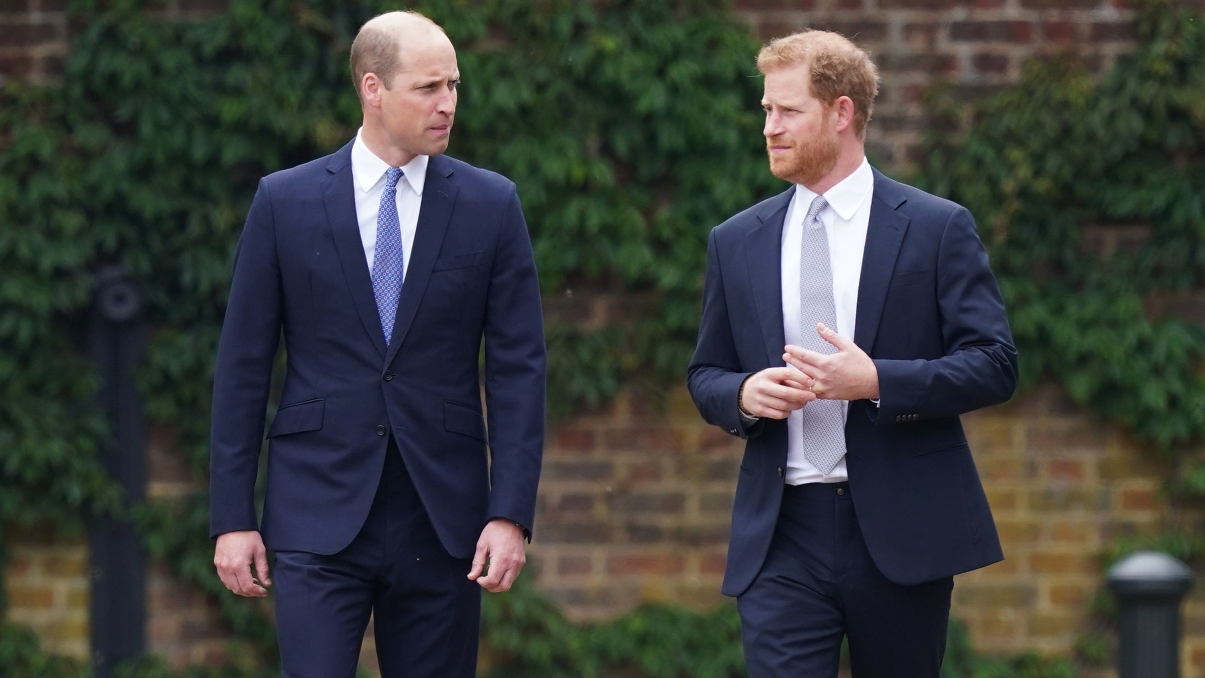 Prince William and Prince Harry arrive for the unveiling of a statue they commissioned of their mother