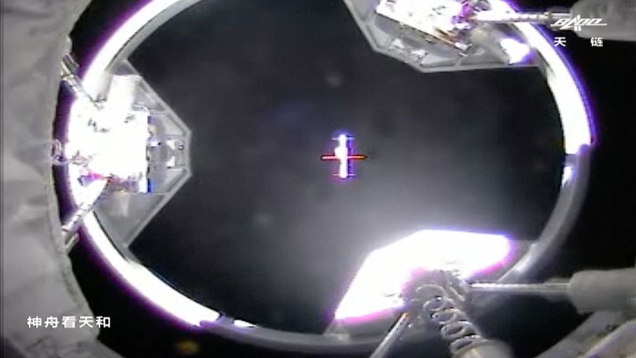 This still from a China's CCTV network shows a view from the Shenzhou 13 spacecraft as it approached the Tianhe core module of the Tiangong space station on Oct. 16, 2021.