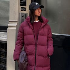 woman in burgundy puffer coat