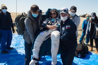 Three astronauts, including NASA's Jessica Meir, shown here, returned to Earth in April 2020 to a sea of mask-covered faces, a safety measure to slow the spread of the new coronavirus.