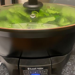 Image of Russell Hobbs multicooker with spinach inside