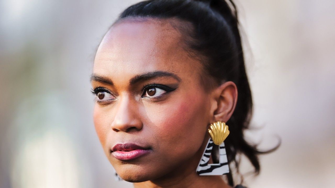 women wearing blush and shell earring