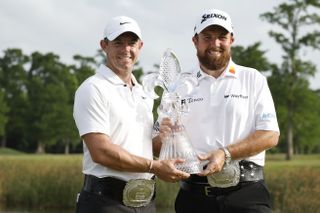 Rory McIlroy and Shane Lowry hold the Zurich Classic of New Orleans trophy